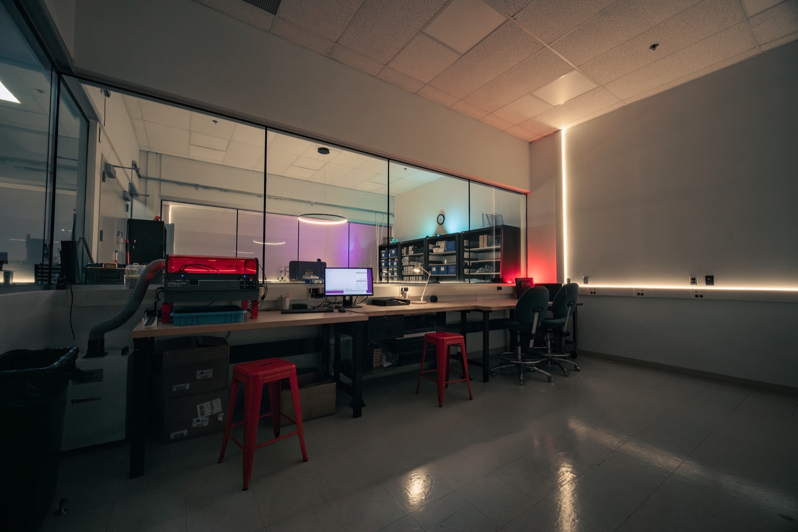 Makerspace lab with machines and colored lighting